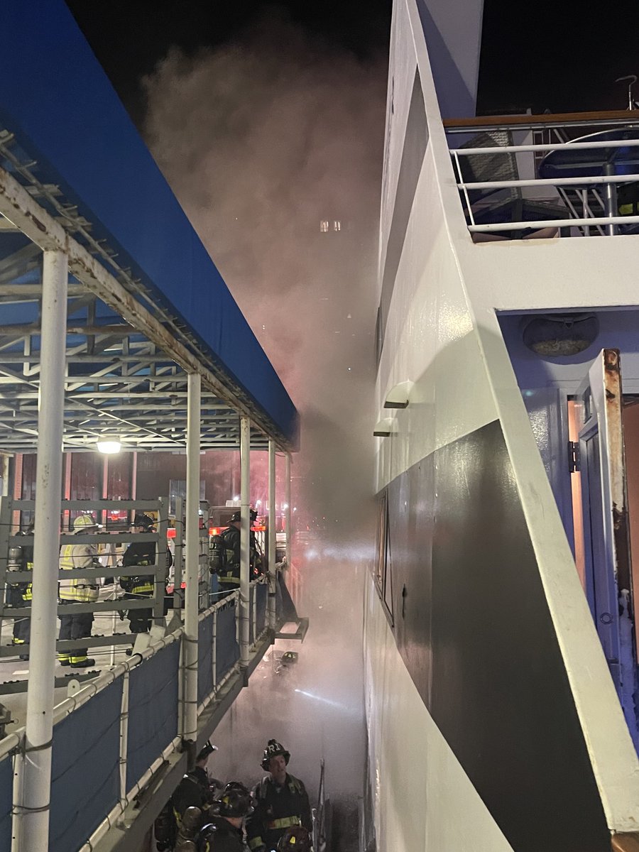 BostonFire's tweet photo. Heavy black smoke has filled the Spirit of Boston from the lower levels . Companies are working from the dock, within &amp; the water to extinguish the fire. https://t.co/fidy2rCVdo