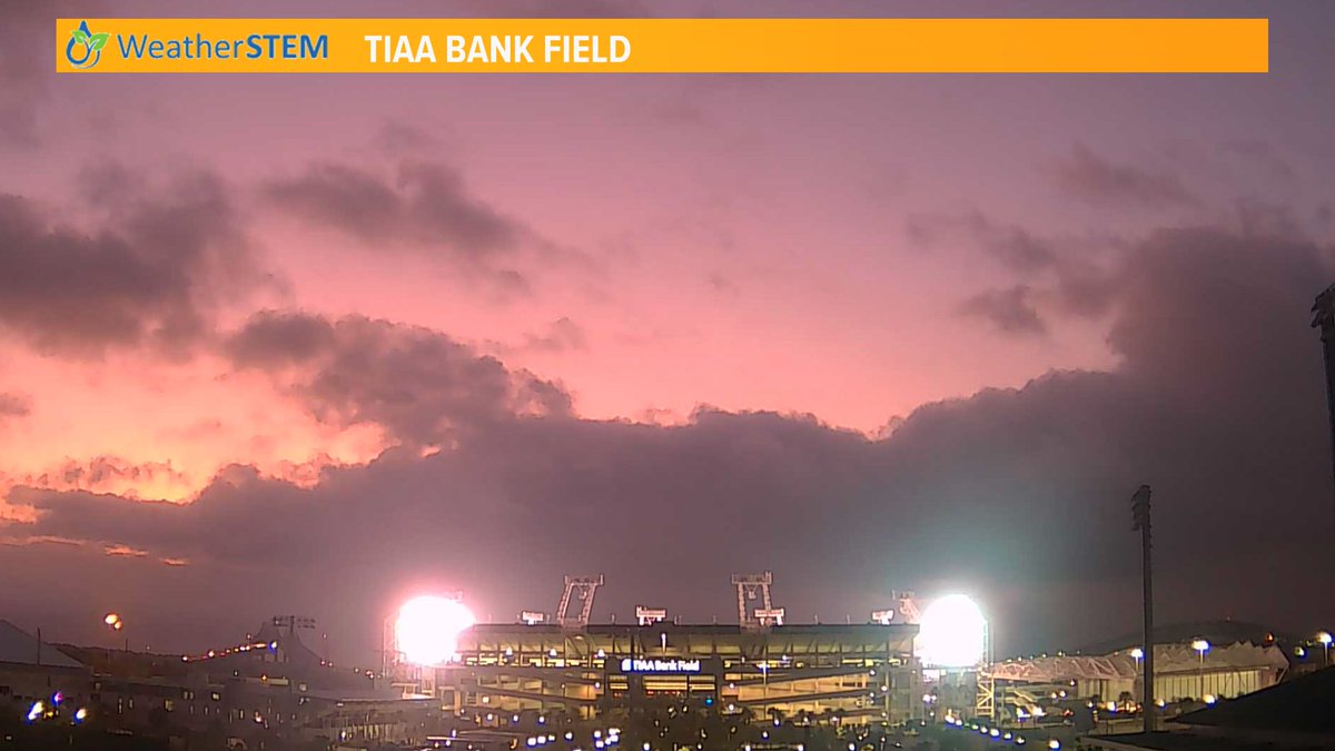 RobertSpetaWX's tweet photo. Lights on at the Bank in front of the sunrise is making for an interesting image on our #weatherstem camera. https://t.co/iHVEn4Dpm3