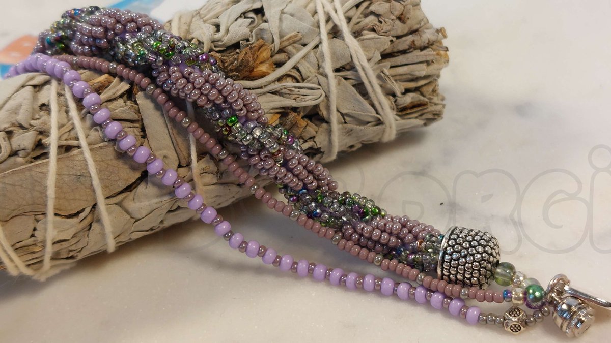 'Lilacs in Spring', fully tension-tested, taken with our new lighting setup! #bead #beadwork #beads #beadjewelry #beadbracelets #beading #beadstore #beadart #beadshop #beadnecklace #beadswork #beadedjewelryofinstagram #seedbeads #corgi #corgibeadlabs  #wisconsin