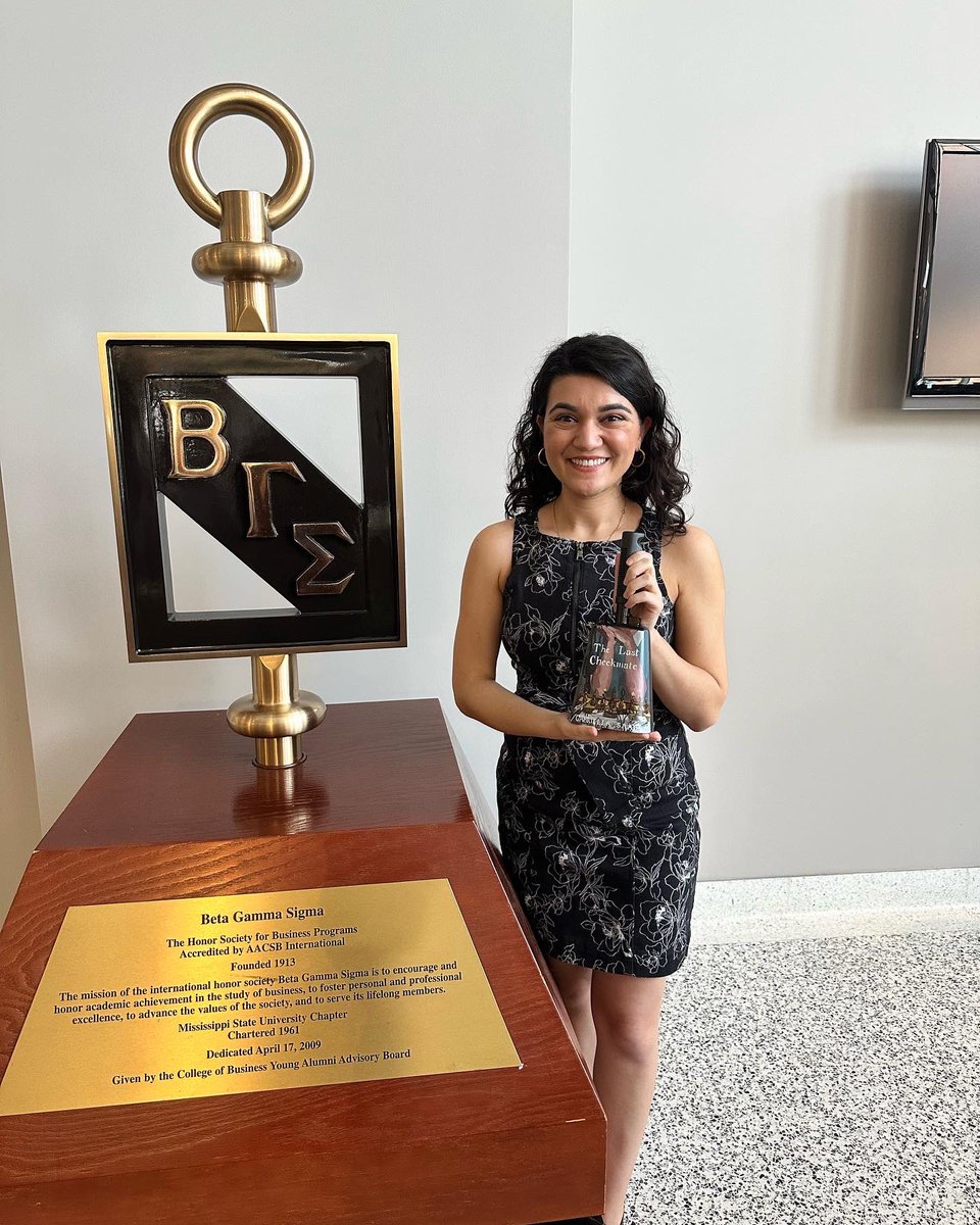 GabriellaSaab_'s tweet photo. A wonderful time speaking at the MS State College of Business Beta Gamma Sigma induction ceremony! All the students & members of the Marketing Advisory Board got a copy of #TheLastCheckmate, & I got a cowbell—a beloved MSU tradition—with TLC’s cover on it! Thanks for having me! https://t.co/kj6uezOS2d