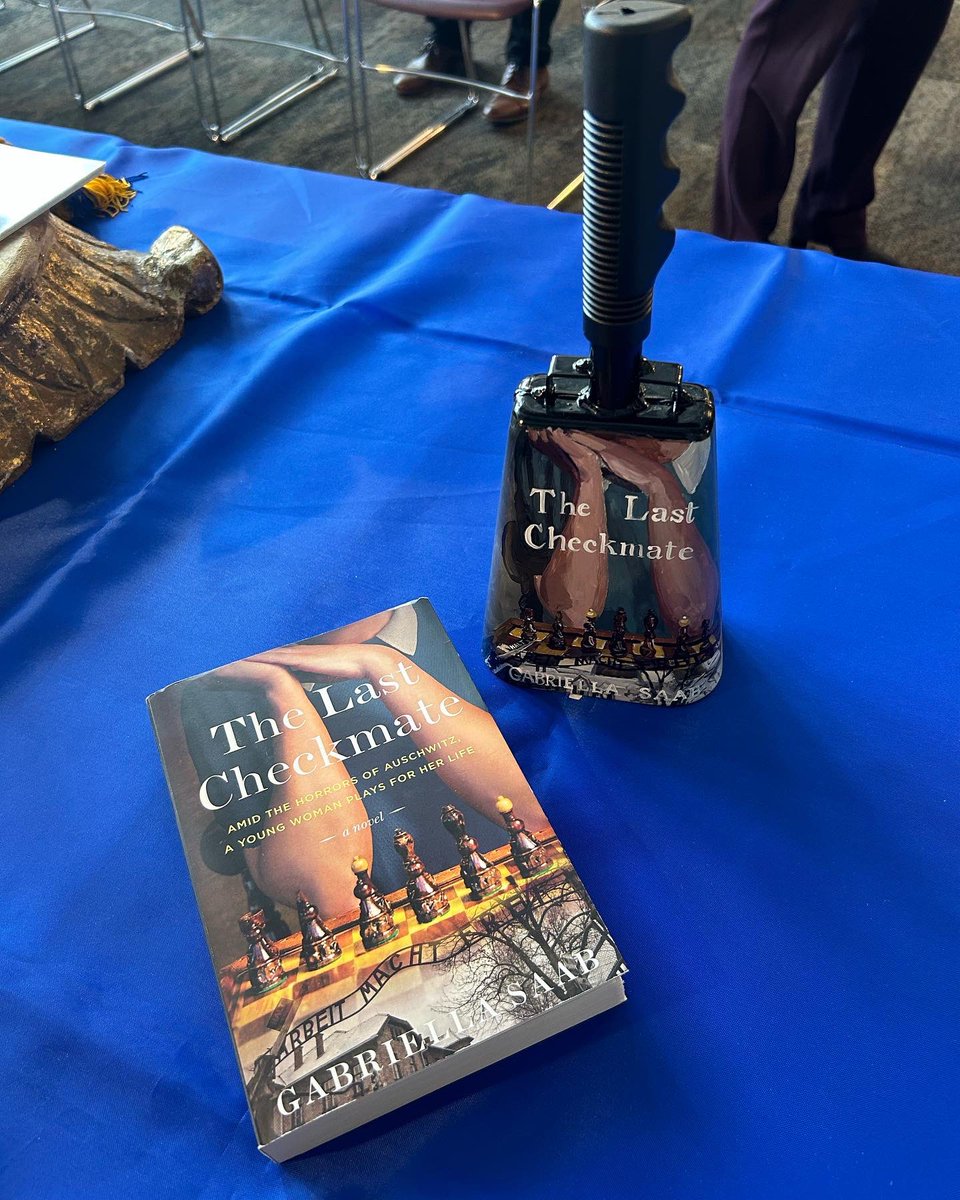 GabriellaSaab_'s tweet photo. A wonderful time speaking at the MS State College of Business Beta Gamma Sigma induction ceremony! All the students & members of the Marketing Advisory Board got a copy of #TheLastCheckmate, & I got a cowbell—a beloved MSU tradition—with TLC’s cover on it! Thanks for having me! https://t.co/kj6uezOS2d