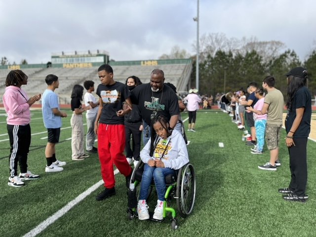 Service-Learning. Our JROTC cadets conducts in-class instruction and a field day with our CBI Department. You should see the joy on these CBI scholar faces.