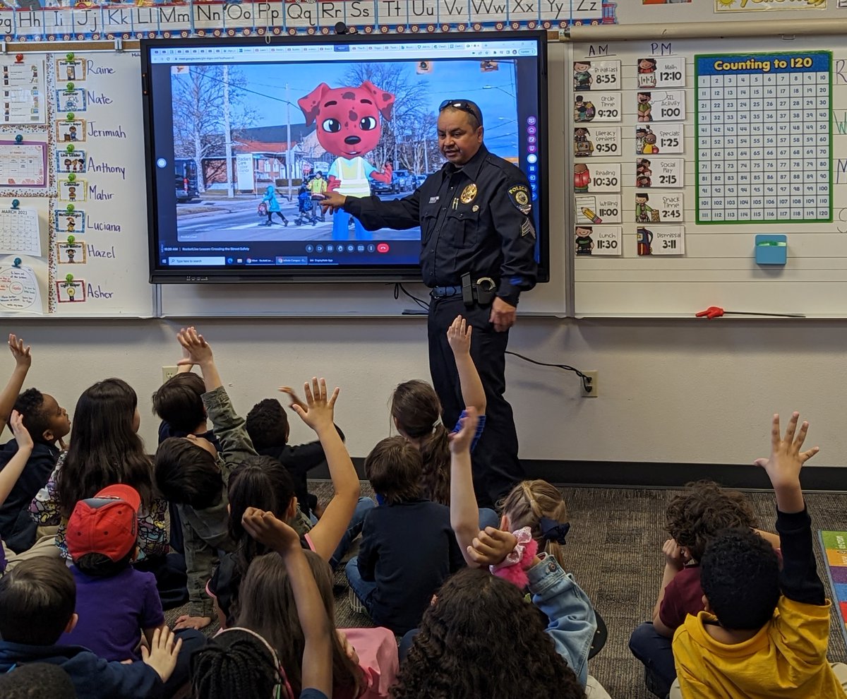 CCSDEngage's tweet photo. 1st graders at Steele Elementary School had a fun lesson with CCSD PD Sargeant Wibowo and safety cadet Rocket as they discussed how to cross the street safely. 
@RocketRules1  @ClarkCountySch  @CCSDFamily #WeAreCCSD #Learningsafety #ccsdcommunity #ccsdengage @ccsdpd https://t.co/tVfZek2eyQ