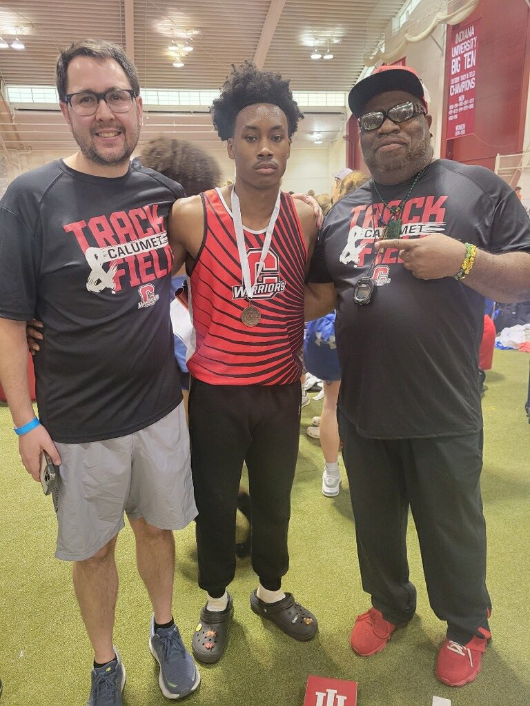 Coach Kim and Coach Kim with TJ Caldwell who finished 3rd in long jump and competed in the 4x200 today at indoor state