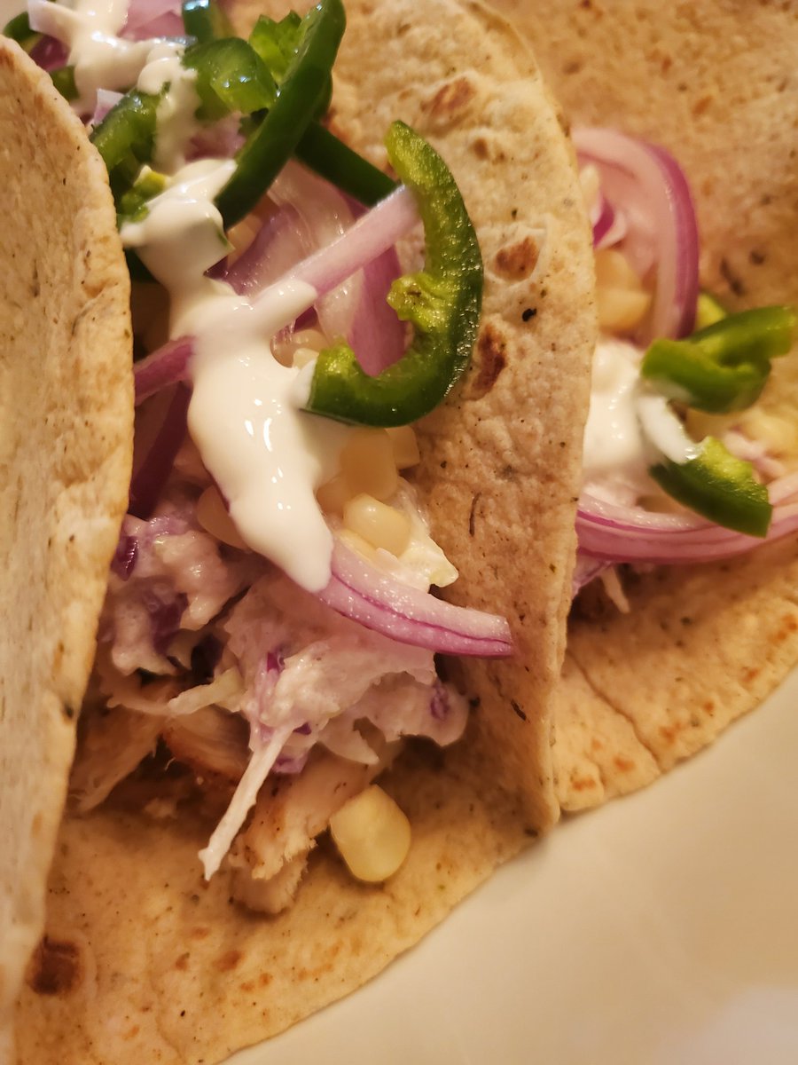 Homemade chicken tacos! 🌮 (I'm still not good at making food look pretty lol)

 We used the jerk chicken we made last night, and I made homemade slaw, lime crema, pickled onions and jalapeños, and corn 🥰