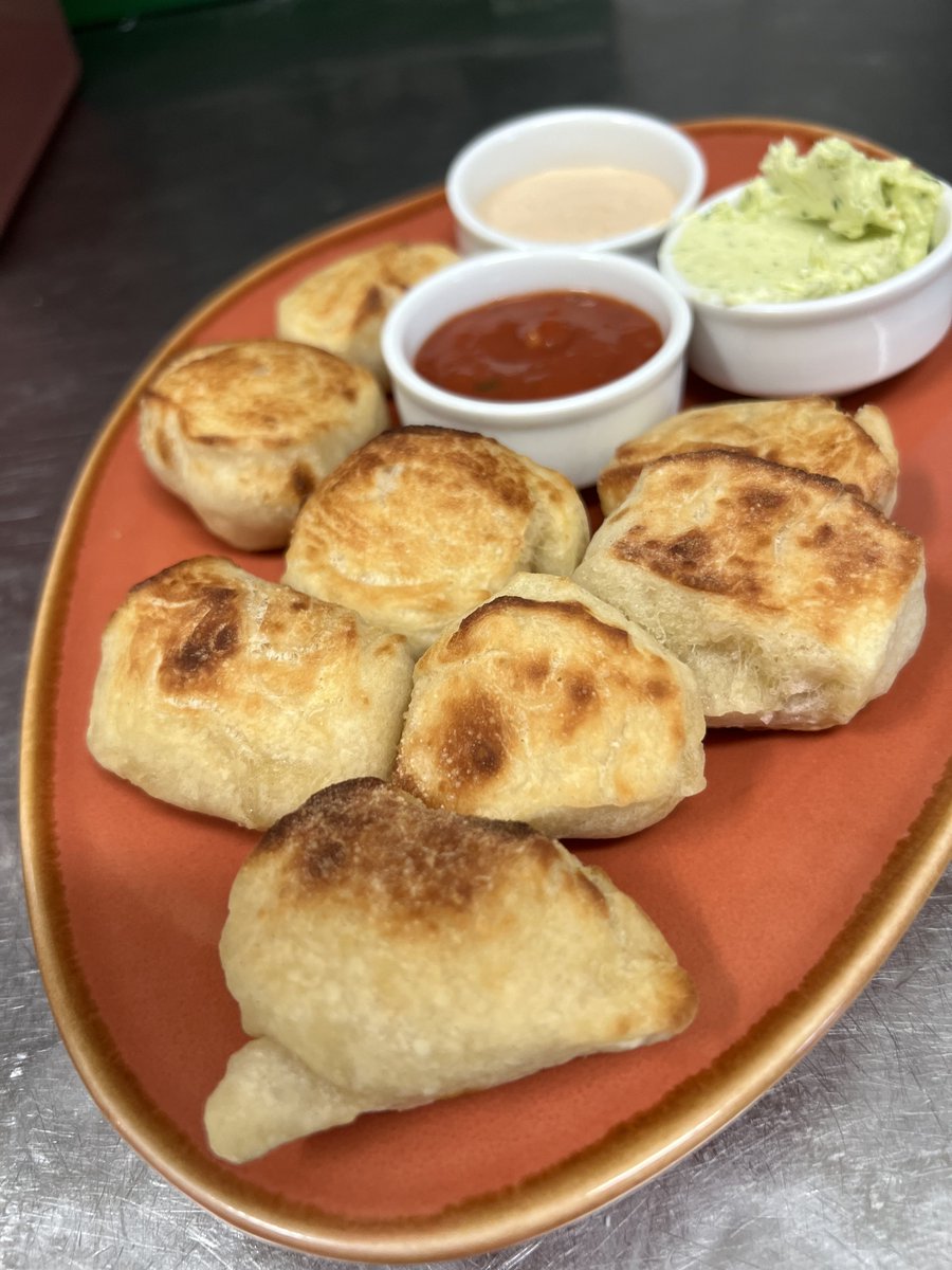 Dough Balls! 😋 Soft, fluffy, and oh-so-dippable, these mouthwatering treats are waiting for you to dive right in. 🍴

Served with a choice of not one, not two, but THREE delectable dips 🌟: creamy garlic butter, spicy hot Caesar dressing, and our signature tomato sauce. Mix and