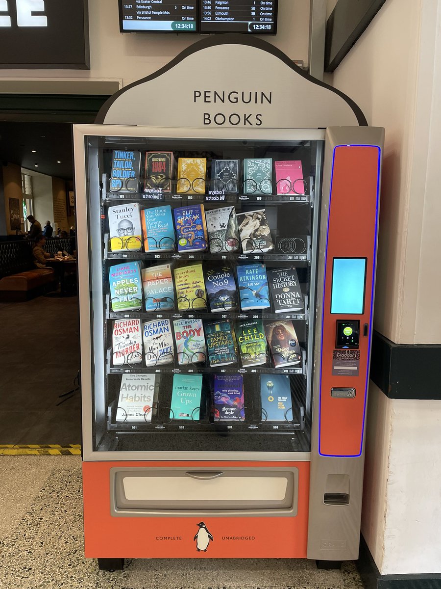 1MarchHare's tweet photo. Bought my first book from the UKs first book vending machine yesterday! It’s at Exeter St David’s train station - apparently that’s where the founder of Penguin books decided to set up the brand, after arriving at the station and finding nothing to read. So cool 📚📙📘📖. https://t.co/lzLJjeOyhH