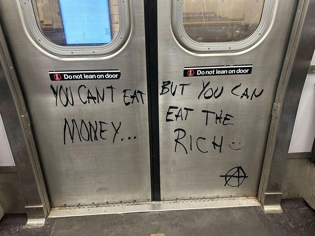 GraffitiRadical's tweet image. "You can't eat money... but you can eat the rich"
Spotted in the New York City subway