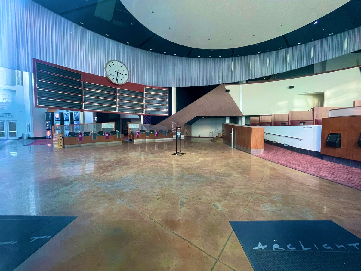 ShowbizSimon's tweet image. Some of the boards at the Arclight Hollywood have fallen down so you can  you can see inside. The foyer is frozen in time.