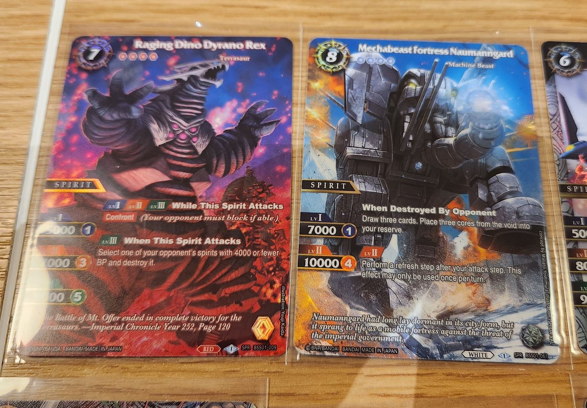 TCGTaj's tweet photo. My box hits from my 2 booster boxes I opened on Friday were Rex and Naumanngard. Swapped the Rex for Royal Potion (because I love the artwork). Would loved to have swapped the Naumanngard for a Deadly Balance, but I didn't get a chance.
#BattleSpiritsSaga #BSSLaunch https://t.co/XC71eqBKxg