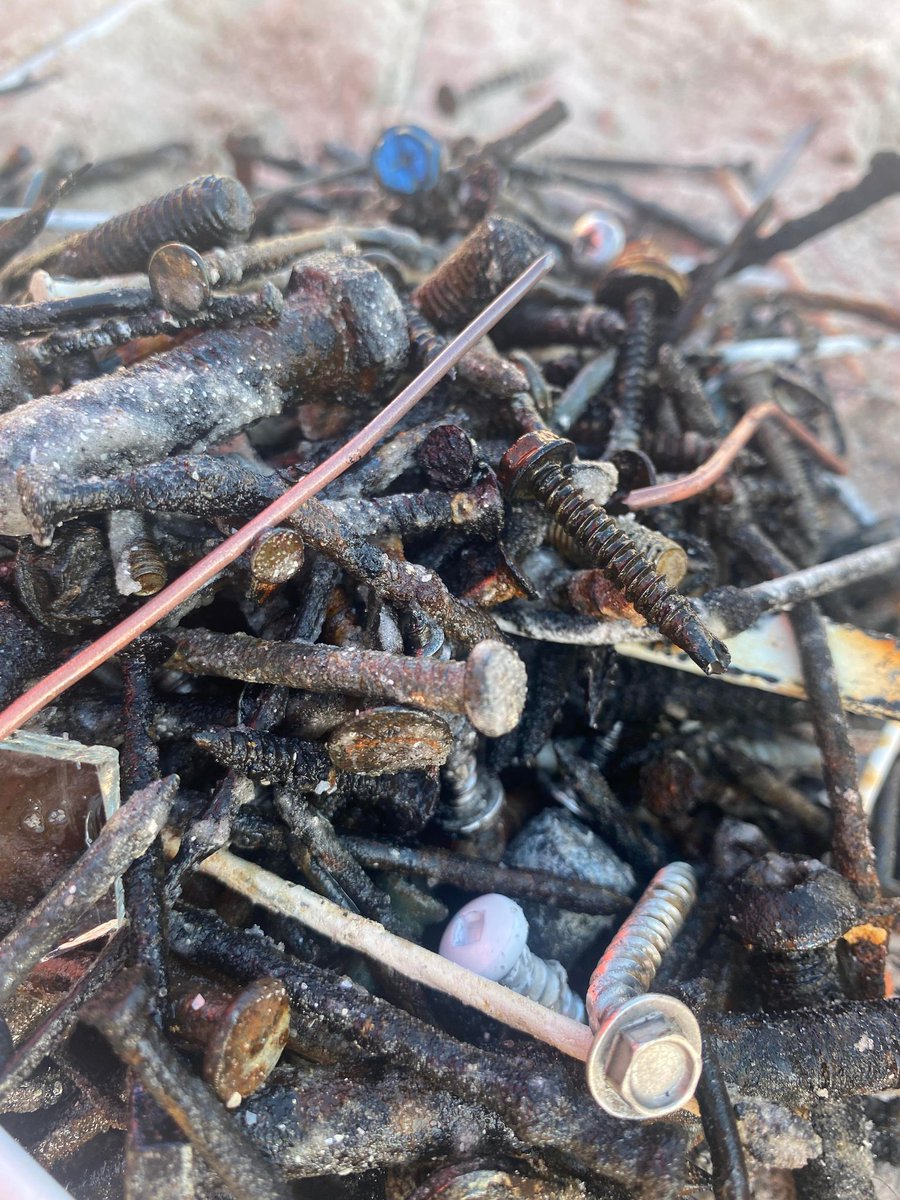 MattDevittWX's tweet photo. HEADS UP! ⚠️ If going to the beach in Southwest Florida, please be mindful of what's in the sand and water even 6 months after Hurricane Ian. Look at all the recovered nails and glass Saturday on a small stretch of Fort Myers Beach. You still can have fun, but be careful and safe, especially if you have children. @WINKNews