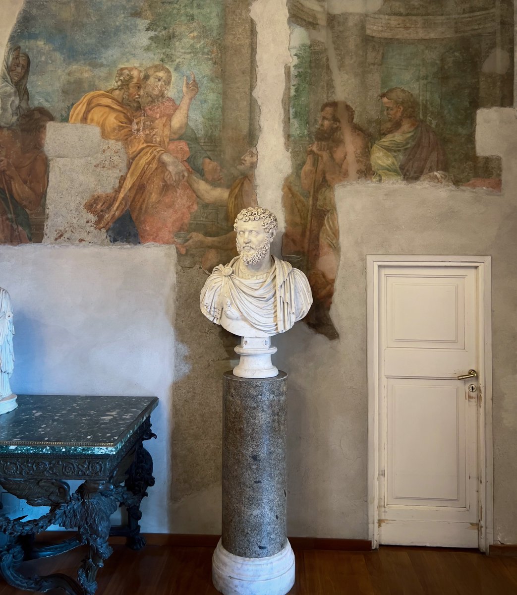 No big deal. Just an ancient portrait of a Roman emperor on a spoliated marble column, against a Renaissance (?) fresco. And a very tiny door that probably leads to John Malkovich's mind (it was locked).

Capitoline Museums, 2022. #Rome #SpoliaSunday