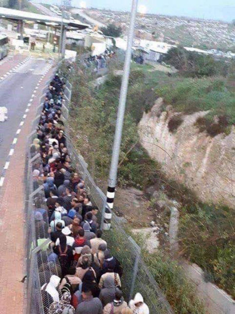 Under Apartheid Israel, this is how Palestinians living in the West Bank go to Jerusalem, Israeli Colonial Settlers can whiz through the 3-lane road to the left. In most cases, Palestinian men under the age of 40 are not allowed in.