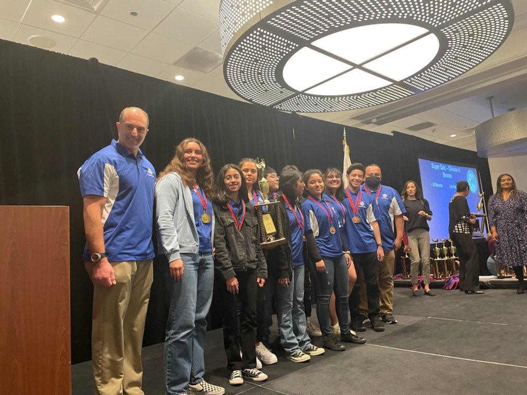 SFrancismath's tweet photo. The @ElRanchoHS Academic Decathlon team is bringing home a trophy! 3rd place in Super Quiz! @cmelgarmath https://t.co/lnLE1mI5Va