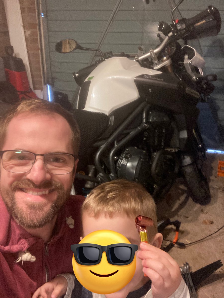 Super useful having a toddler help as you change the exhaust. The party blower added comedic effect. All went well until he punched my 8mm spanner mid-task. #BikerLife #ToddlerHelp #Biker #SummerPrep #AdventureBike