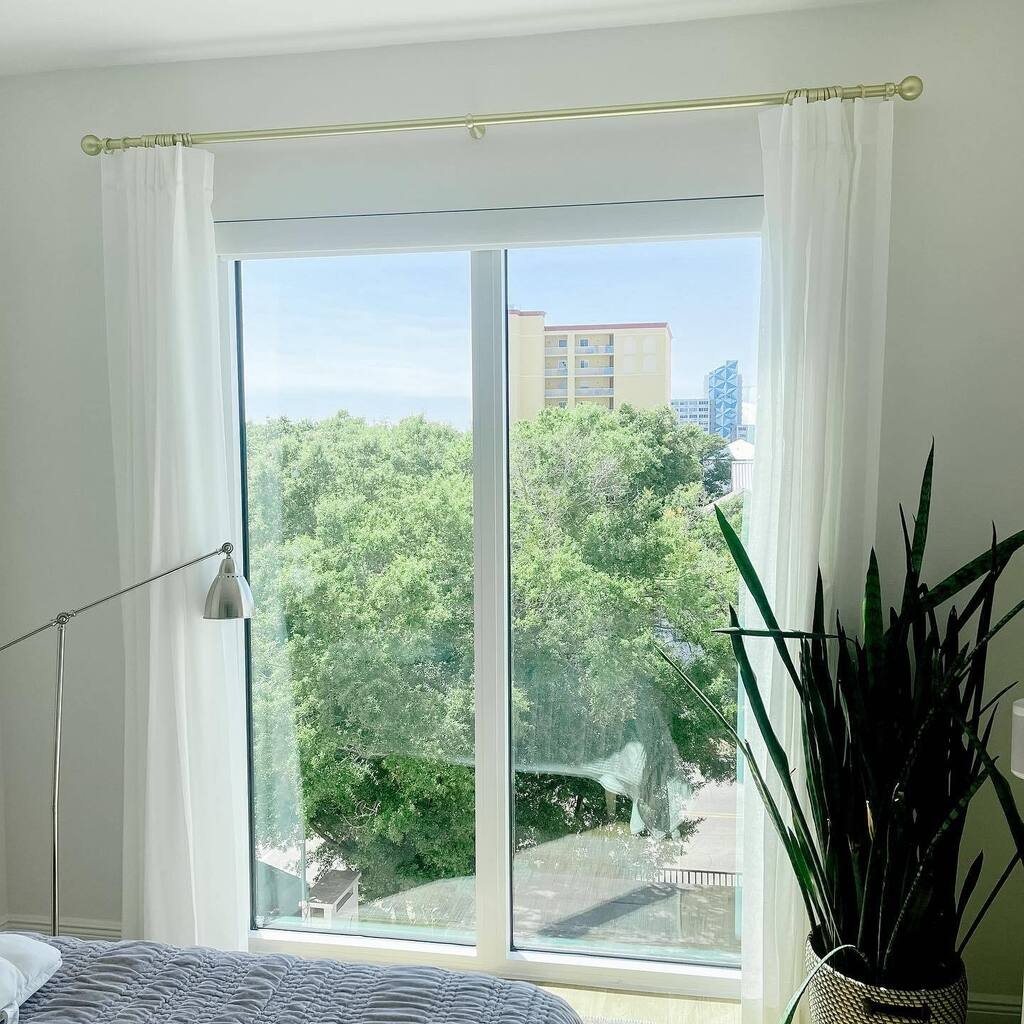 Sheer draperies with accents of gold and a touch of blue St Pete sky - what’s not to love?!