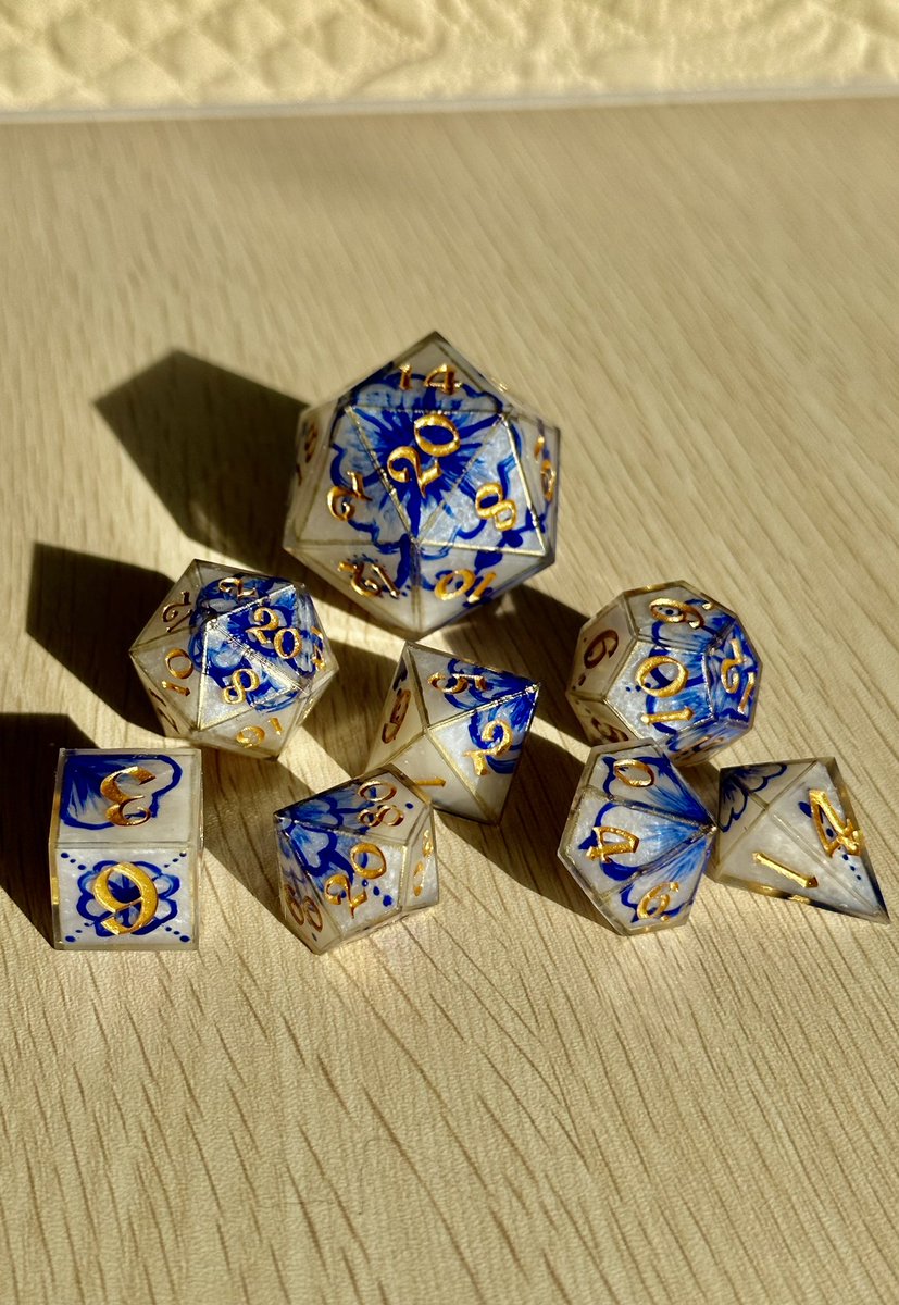 MapleMothDice's tweet photo. I have custom dice commissions available on my Etsy right now! Genuinely go fast if you want them because they never last more than a week and I only do 2-3 a month usually! Some cute dice examples of mine in the pictures :) #dnddice #customdice #handmadedice #polyhedraldice https://t.co/PZTlGx6cTk