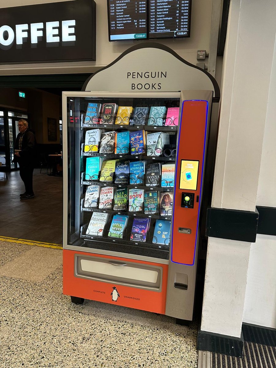 DevonCC's tweet photo. 📚 Exeter St David's has a book vending machine, installed by Penguin UK Books.

In 1935, Sir Allen Lane was inspired to create Penguin Books when he couldn't find a book to read at Exeter St. David's. The company has ensured modern day commuters won't face the same problem. https://t.co/5bh0mWUvRw