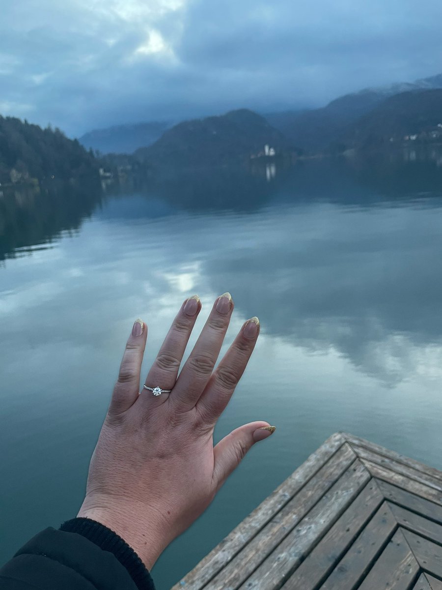 asht_chamba's tweet photo. Looking out to a backdrop of Lake Bled, astro dj speaker playing acoustic music, my boyfriend proposed #astrodj #salesforce #engaged #lakebled https://t.co/uQjRf1unth