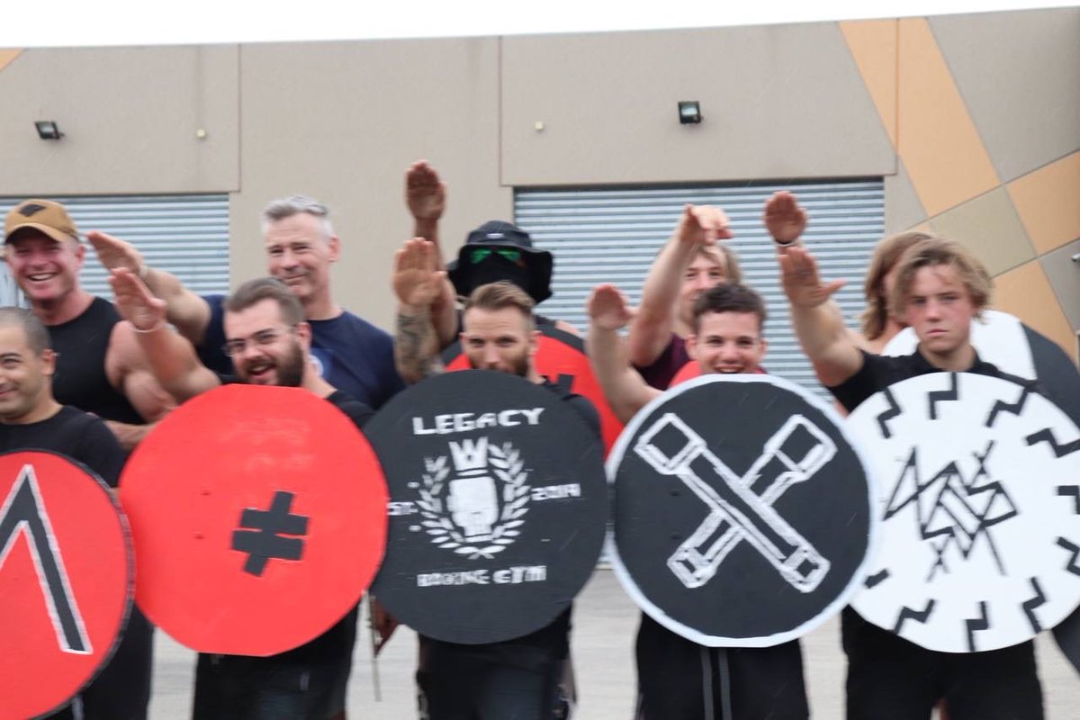 WhiteRoseSocAU's tweet photo. Do you recognise any of these young neo-Nazis who were posing for a photograph outside Legacy Boxing Gym on 25 March, after their children's arts and crafts hour making paper plate shields to defend their playground? Please DM or e-mail thewhiterosesociety@protonmail.com. https://t.co/KUrFbvVOmb