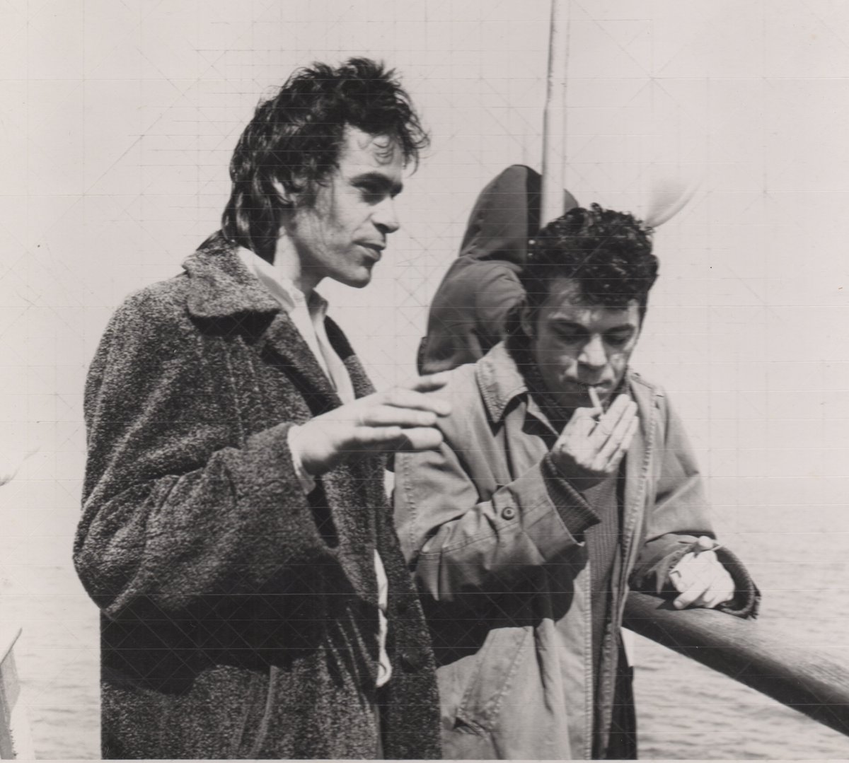 Ian Dury 12 May 1942 - 27 March 2000. Ian with his friend Martin 'Smart' Cole on the boat to Lundy Island c1978. 📸© Elizabeth Rathmell