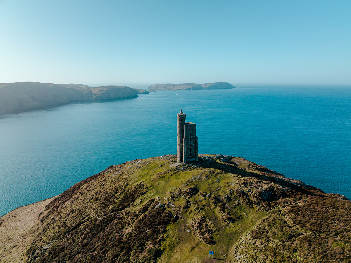 Perched majestically on Bradda Head, Milner Tower has stood for over 150 years! Commanding breathtaking views of Port Erinthis captivating landmark was built to honour local philanthropist and benefactor, William Milner.

#isleofman #iomstory #walkingtrails