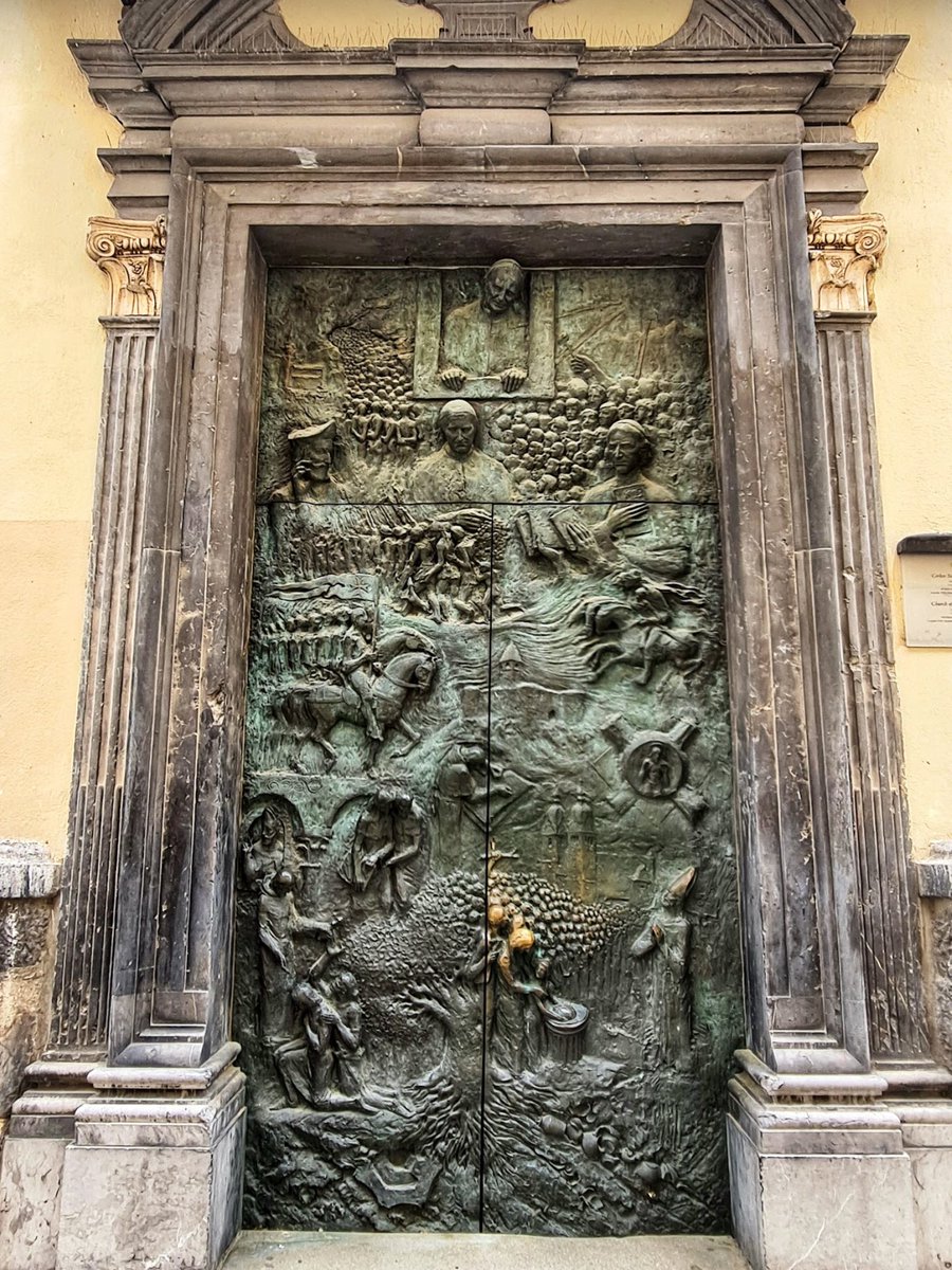 Architectolder's tweet photo. Bronze door on the Cathedral of St Nicholas in the capital city of Ljubljana, Slovenia 🇸🇮 https://t.co/OcQmnxcglb