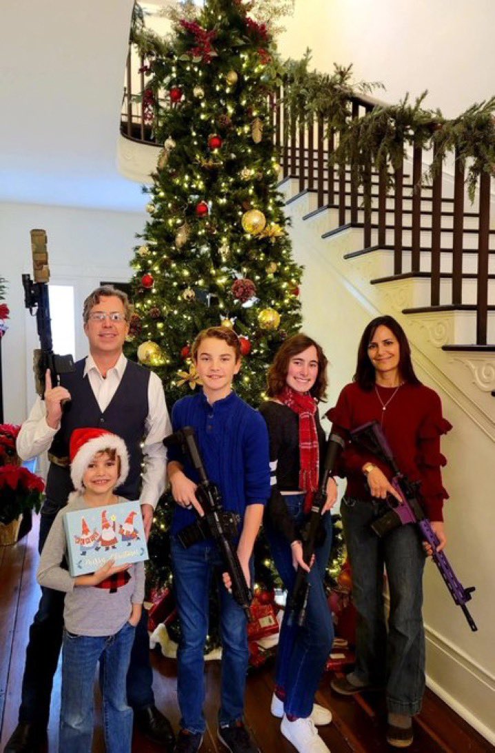 This is the fraud @AndyOgles that represents the district where 3 Elementary school children and 3 staffers were just slaughtered by a shooter wielding the same weapons as his…Christmas photo.