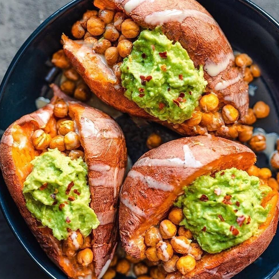 RAWHealthUK's tweet photo. There's no better dinner than a loaded sweet potato that's filling, healthy and nutritious! Take some inspo from @cookingforpeanuts (IG) - she's topped hers with tandoori spiced chickpeas, guacamole, chilli flakes and tahini.

Use our whole sesame tahini for a boost of flavour! https://t.co/6L2etZxL82