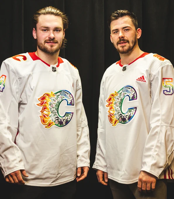 Rasmus Andersson and MacKenzie Weegar wearing the 2023 Pride Night warm-up jersey