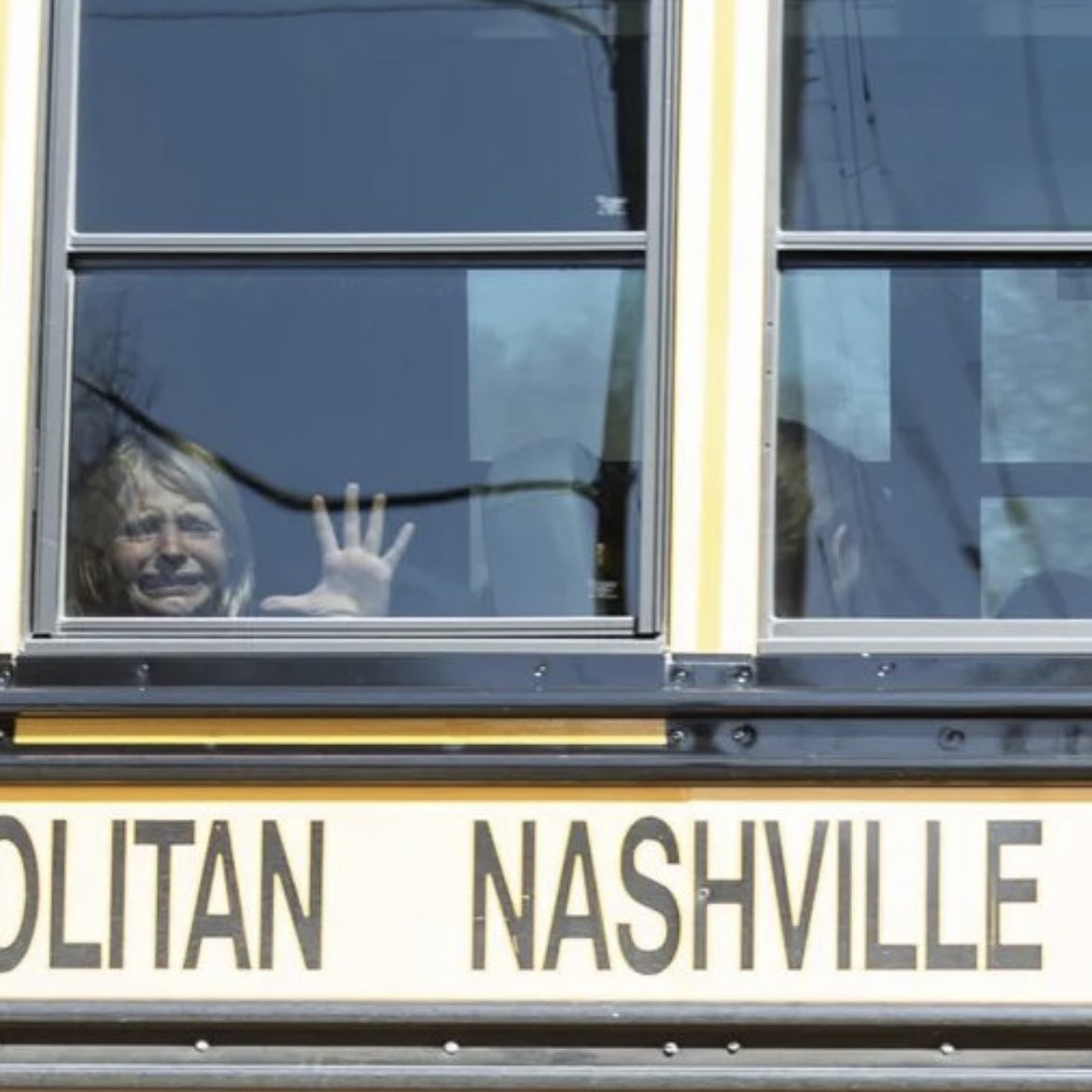 A child crying on a school bus