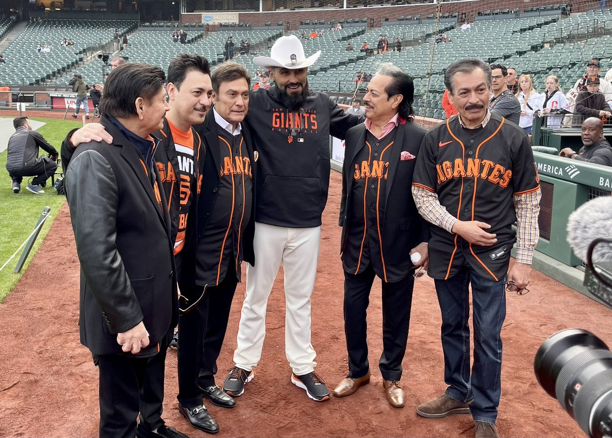 newsdamian's tweet photo. Look who’s on the  field at @oraclepark 

@lostigresdelnorte throwing Out the first pitch on the day @sergioromo54 throws his last, retiring as a @sfgiants 
El Mechón with #LosJefesDeJefes

Photo: @scottuck https://t.co/x8At7qpfxu
