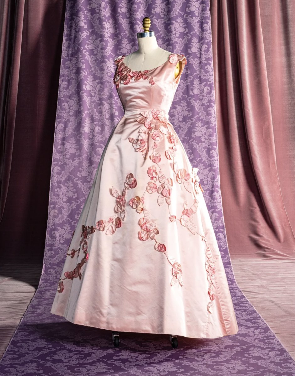 LaurenCDeutsch's tweet photo. Today's #ootd featuring #CherryBlossompink is this 1962 Ann Lowe evening dress. Silk rose rosettes begin from the shoulders and top of the bodice and come cascading the down from the waist all along the skirt. Gorgeous! @metmuseum #fashionhistory https://t.co/yAmKjw9G8s