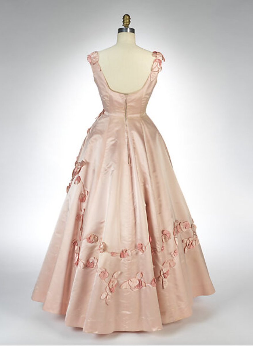 LaurenCDeutsch's tweet photo. Today's #ootd featuring #CherryBlossompink is this 1962 Ann Lowe evening dress. Silk rose rosettes begin from the shoulders and top of the bodice and come cascading the down from the waist all along the skirt. Gorgeous! @metmuseum #fashionhistory https://t.co/yAmKjw9G8s