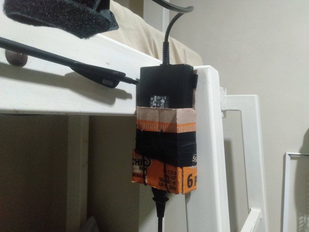 There's a laptop charger holder on the bunk bed ladder now.