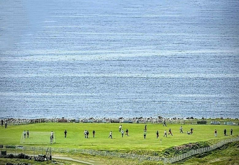 Football in Ireland of a fine day! Care to guess where in the country this is? 🇮🇪 ⚽