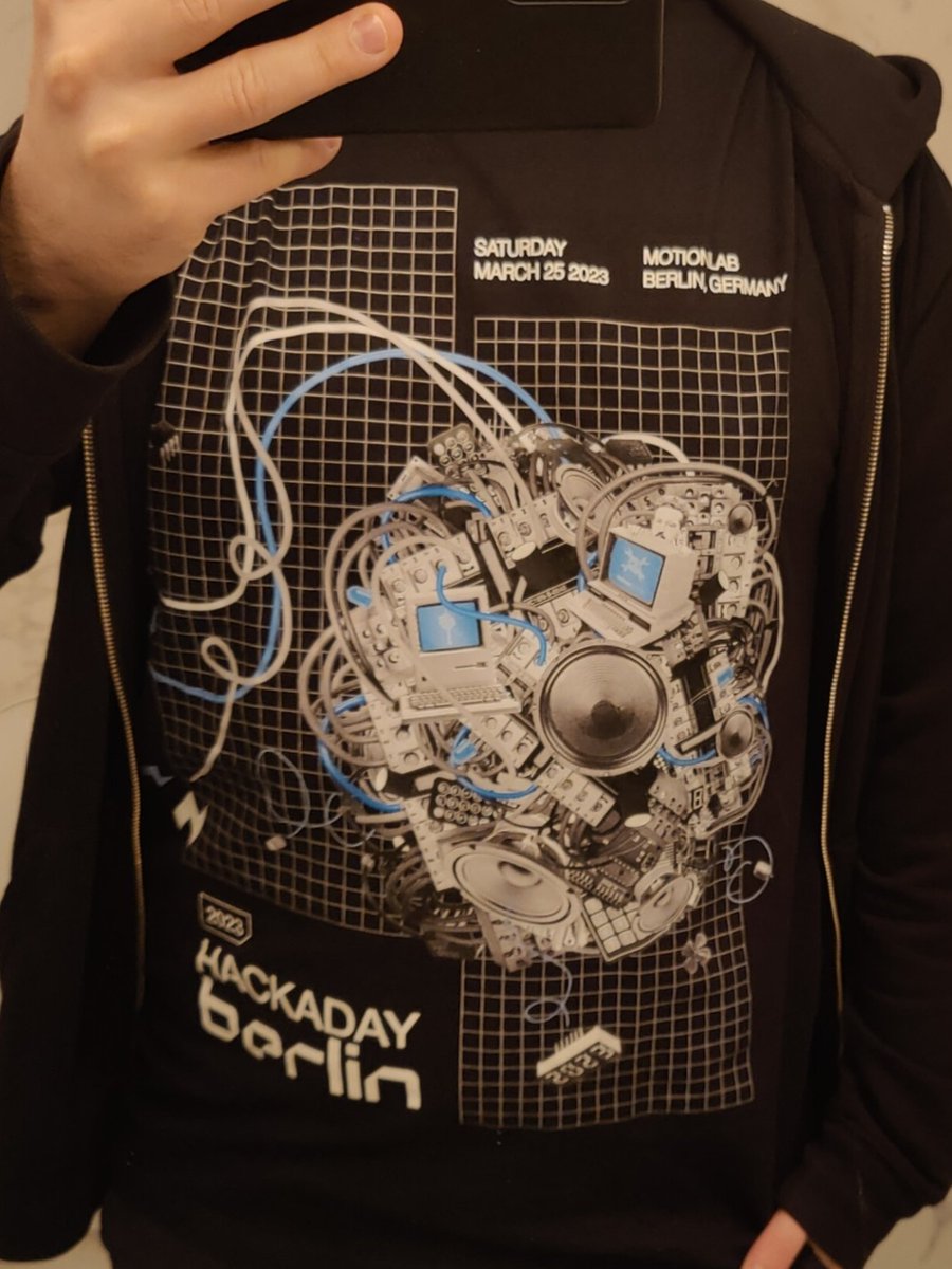 arturo182's tweet photo. My #HackadayBerlin t-shirt has people asking a lot of questions already answered by my #HackadayBerlin tshirt. https://t.co/dhMSa9ef2t