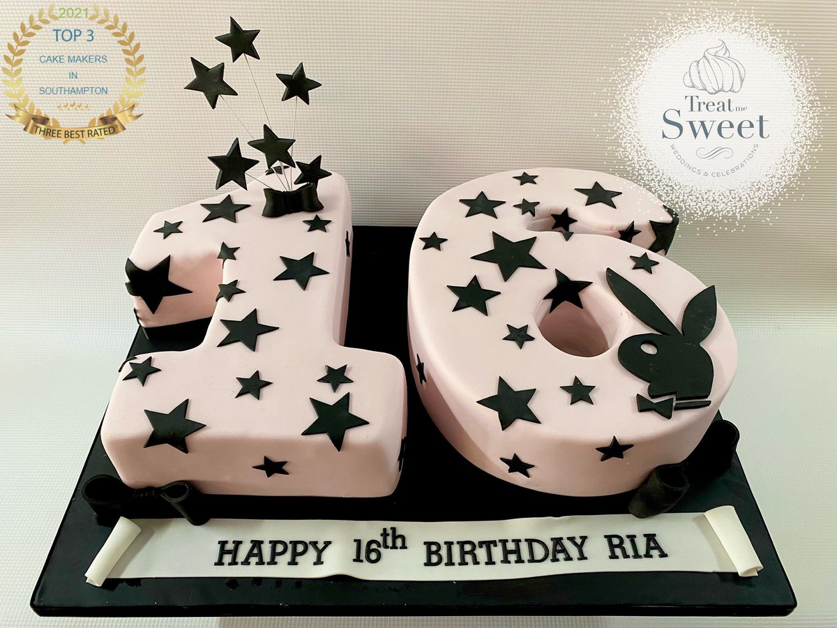 Sculpted pink and black Playboy number sixteen cake.
