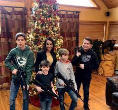 It's a sick sob that has their children pose with weapons of war in the age of school shootings. 