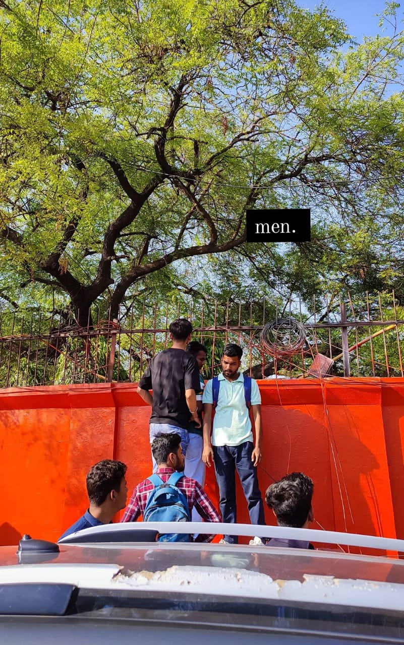 men climbing the walls of Indraprastha college