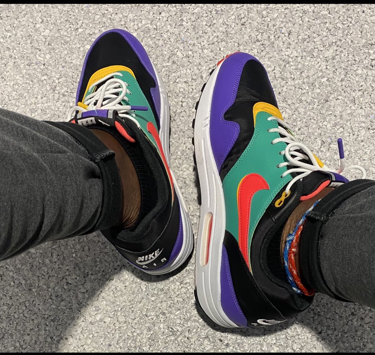 Year 3️⃣of #MarchMAXness! Now Day 28 - Taking another full turn on the color palette 🎨 so many pairs not enough days left 😬 in the month * Air Max 1 - Windbreaker multi Black#allLove 🤍♠️💜💛👀 @hisexcellence79 @nikestore #airMaxGang #AirMaxMonth #sneakersliveheatingup