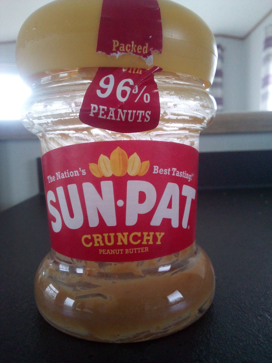 Frugaldom's tweet photo. Anyone else found this @SunPatOfficial jar design annoying? What possible advantages are there to having such a ridiculous shape for plastic containers? Do they sell bent spoons to get the last of the product from the bottom of these jars? #baddesign #notuserfriendly #wasteful https://t.co/IVO8xxRVIK
