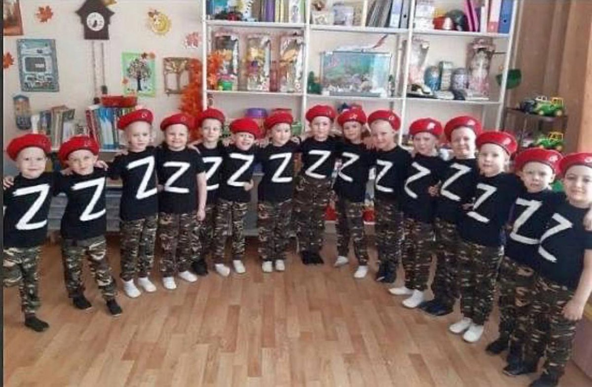 I've seen many similar photographs from Russia by now. But my heart still skips a beat.

At this age they can be told anything. Now their childhood memories will forever be linked to this version of swastika.

What does the future hold for us?