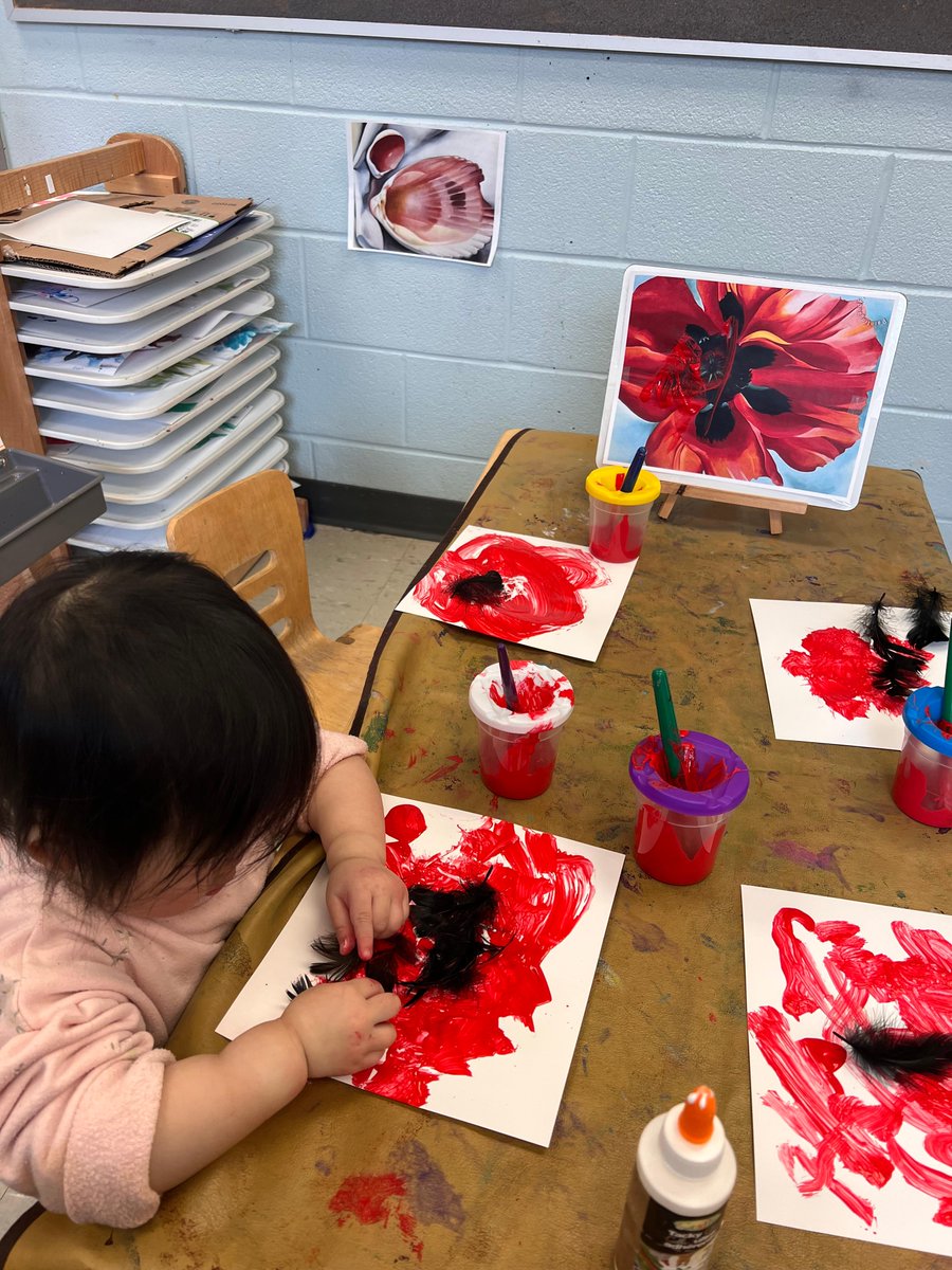 kcce_yr's tweet photo. The children at Carnegie CCC were given red paint with black feathers to recreate Georgia O’Keeffe’s Oriental Poppies painting. The children used the red paint on the paper and glued the black feathers for the black part of the poppy. https://t.co/QSYjMoHMZq