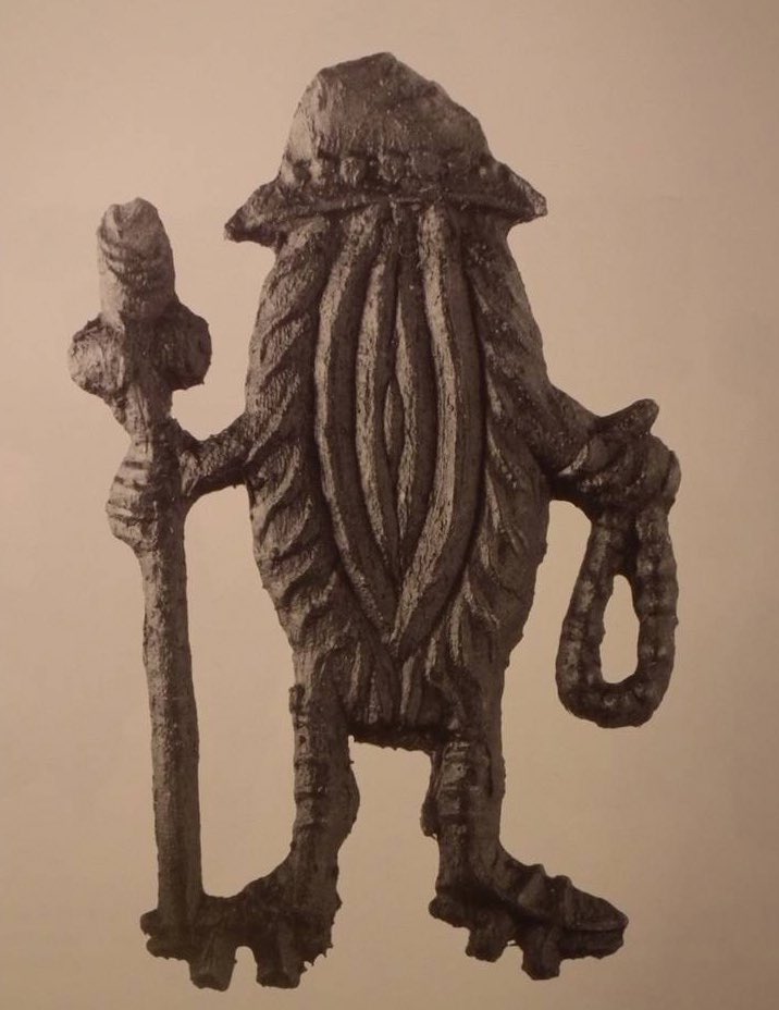 WeirdMedieval's tweet image. a medieval pewter badge depicting a vagina wearing a hat and carrying a walking stick
