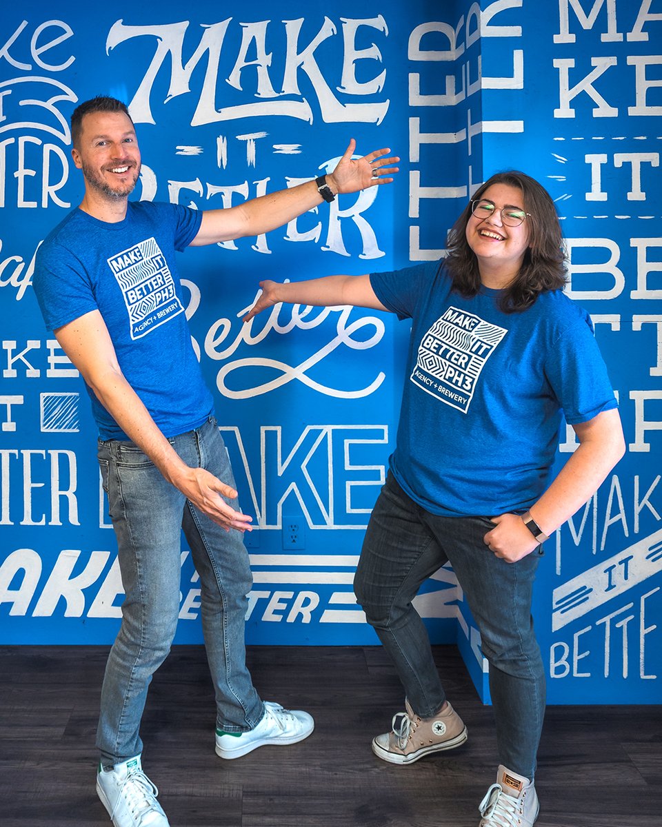 Behold the dynamic design duo, Rick and Jess, matching in their "make it better" tees! These two are always on the same wavelength when it comes to tackling the toughest marketing challenges. Who needs a superhero when you have Rick and Jess on the job?