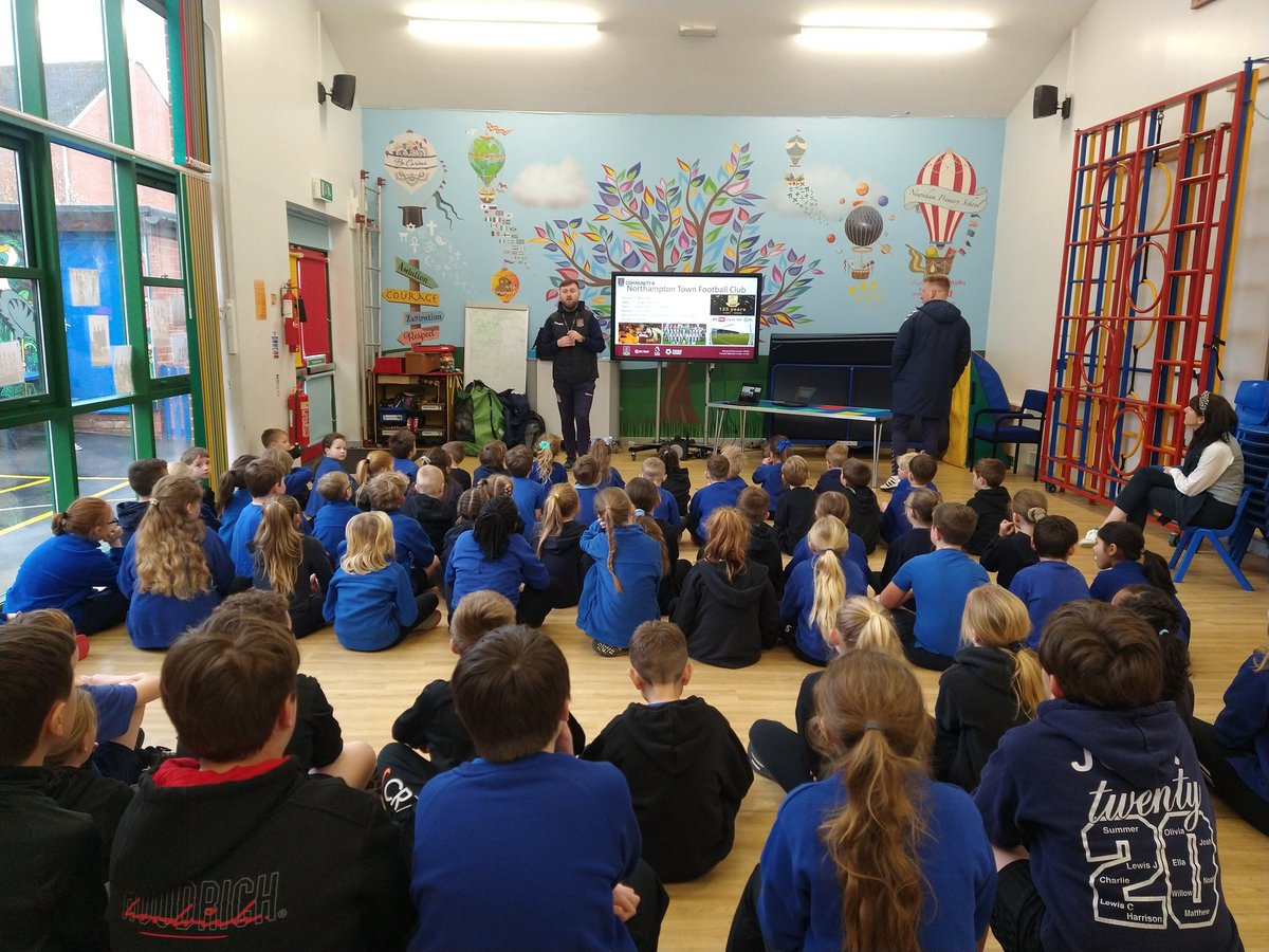 fox_damon's tweet photo. Great to be back out in schools seeing @JoeD_NTFC deliver a fantastic assembly on the history of @ntfc to start our @NTFC_CT #Takeoverday at @NewnhamPrimary #connectingcommunities #ntfc #cobblers #northamptonshire @DRETsport https://t.co/D3l9GFIGBX
