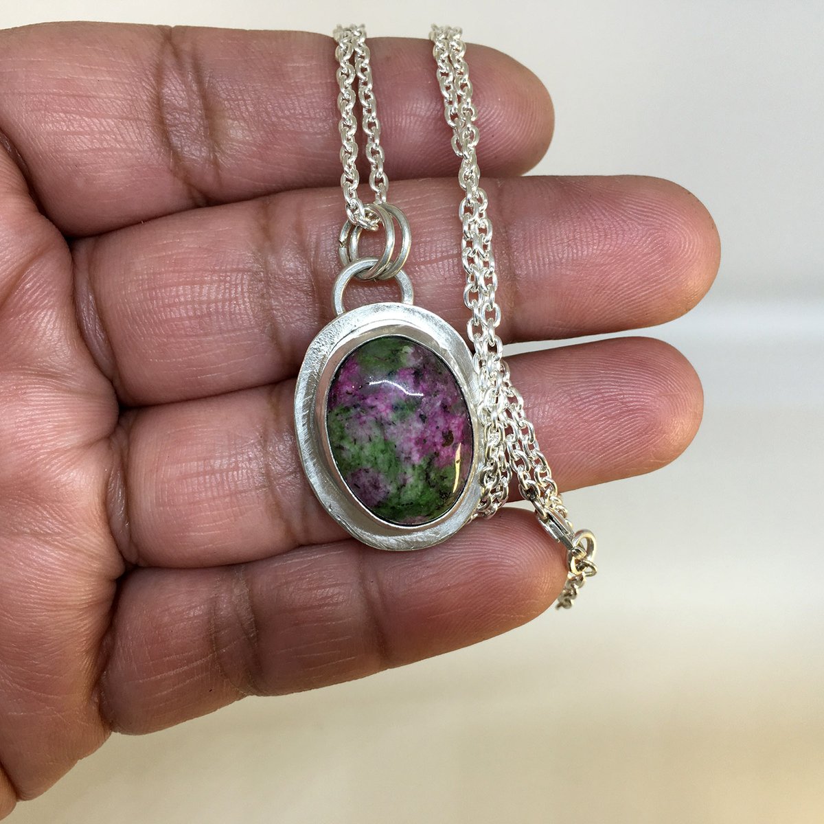 XicoStation's tweet photo. Ruby zoisite grabs your attention on this sterling silver pendant w/ a fine silver bezel. The shiny sterling silver chain is cable style. 2 silver rings connect pendant to chain. This necklace is a stylish piece of functional art.

🌟 Make it yours today! 
https://t.co/wLXmKk4GWe https://t.co/1QULDUE0so