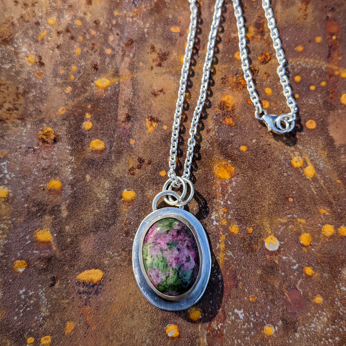 XicoStation's tweet photo. Ruby zoisite grabs your attention on this sterling silver pendant w/ a fine silver bezel. The shiny sterling silver chain is cable style. 2 silver rings connect pendant to chain. This necklace is a stylish piece of functional art.

🌟 Make it yours today! 
https://t.co/wLXmKk4GWe https://t.co/1QULDUE0so