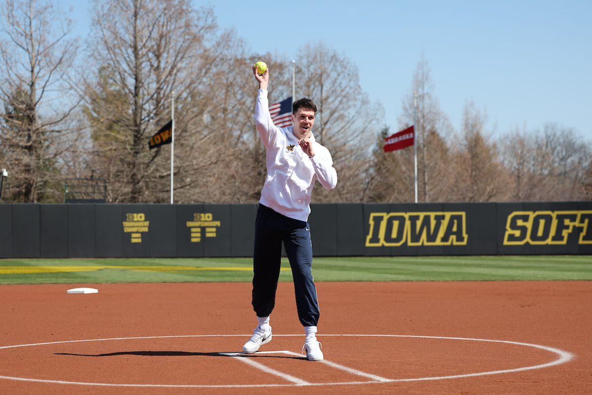Iowa Men’s Basketball (@iowahoops) on Twitter photo From the hardwood to the circle. Look who threw out the first pitch at today's <a href="/iowasoftball/">Iowa Softball</a> home opener. #Hawkeyes 🥎 From the hardwood to the circle. Look who threw out the first pitch at today's <a href="/iowasoftball/">Iowa Softball</a> home opener. #Hawkeyes 🥎